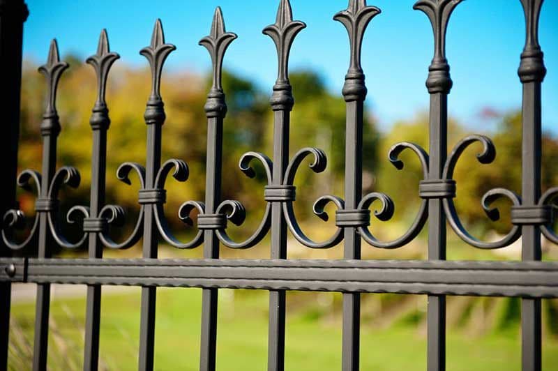 Decorative iron work that sharpens the frontage instead of closing it off.